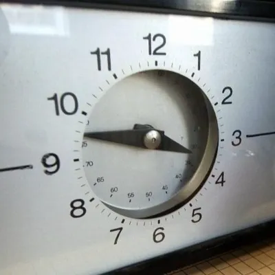 A wall clock being assessed in a repair shop