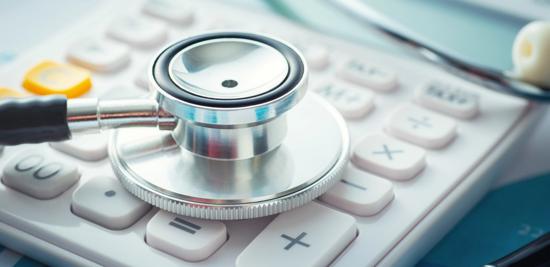 stethoscope on calculator