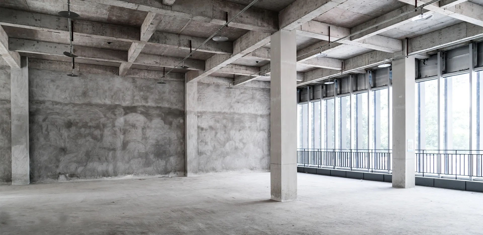 The concrete interior of a vacant building.