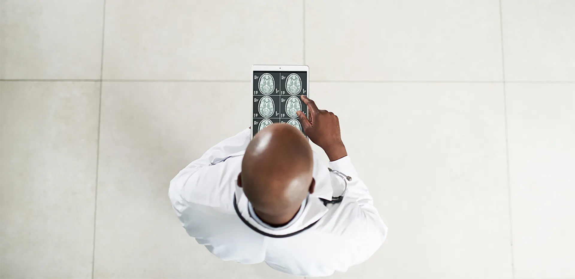 A doctor looking at scans of a patient's brain.