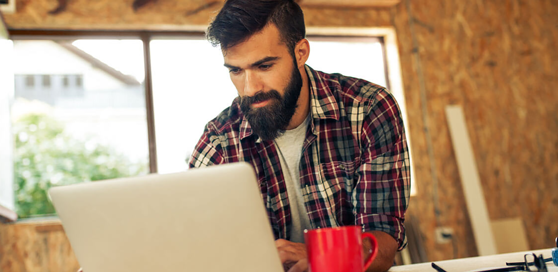 A contractor working on a laptop computer.