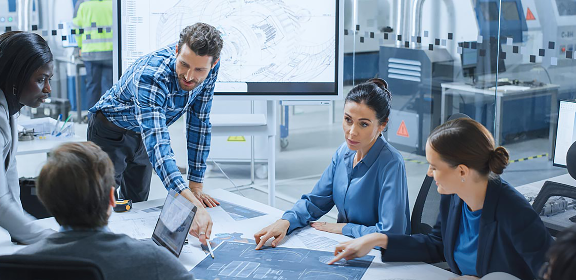 A group of professionals reviewing patented plans.