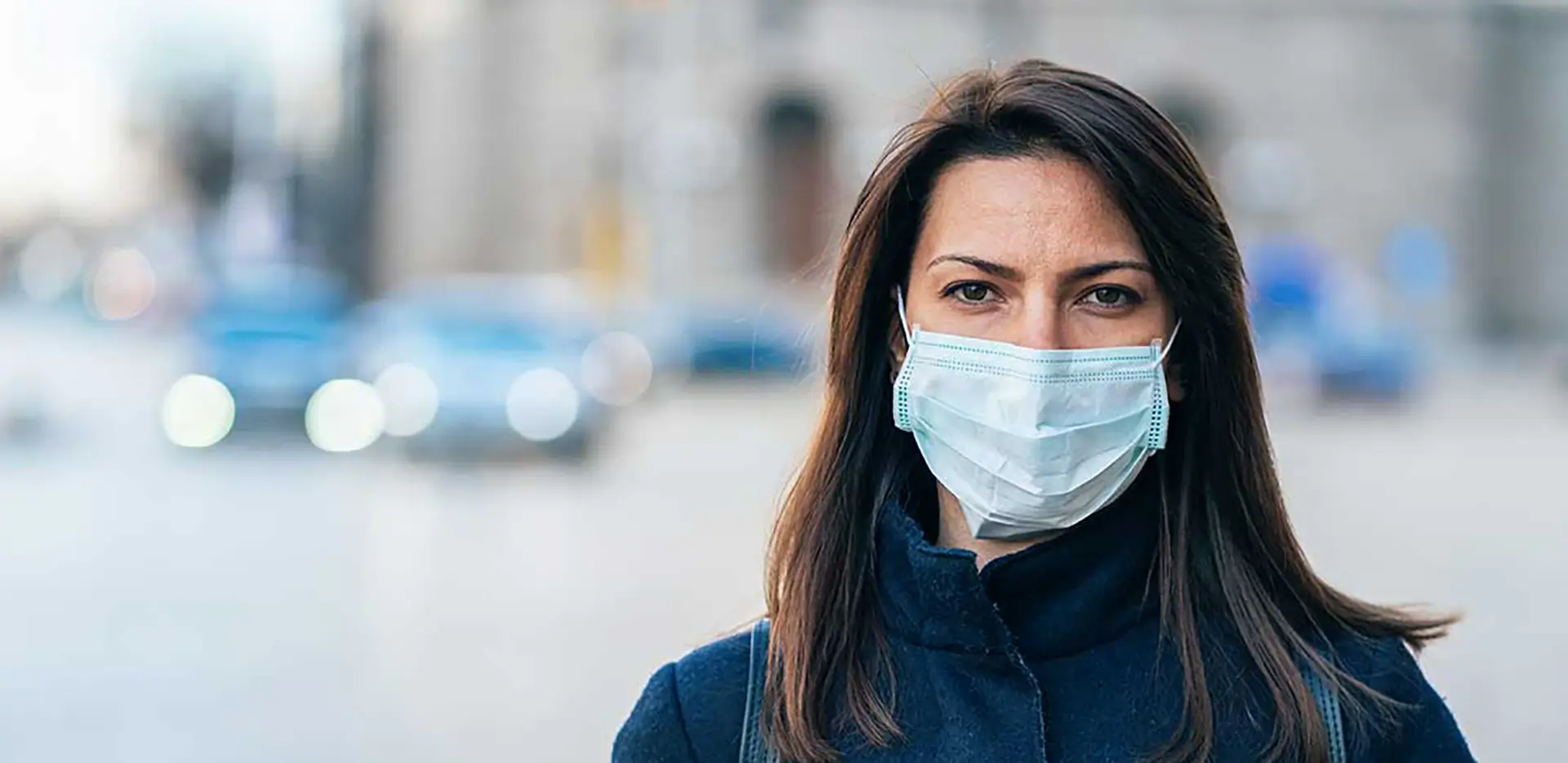 A woman wearing a face mask.