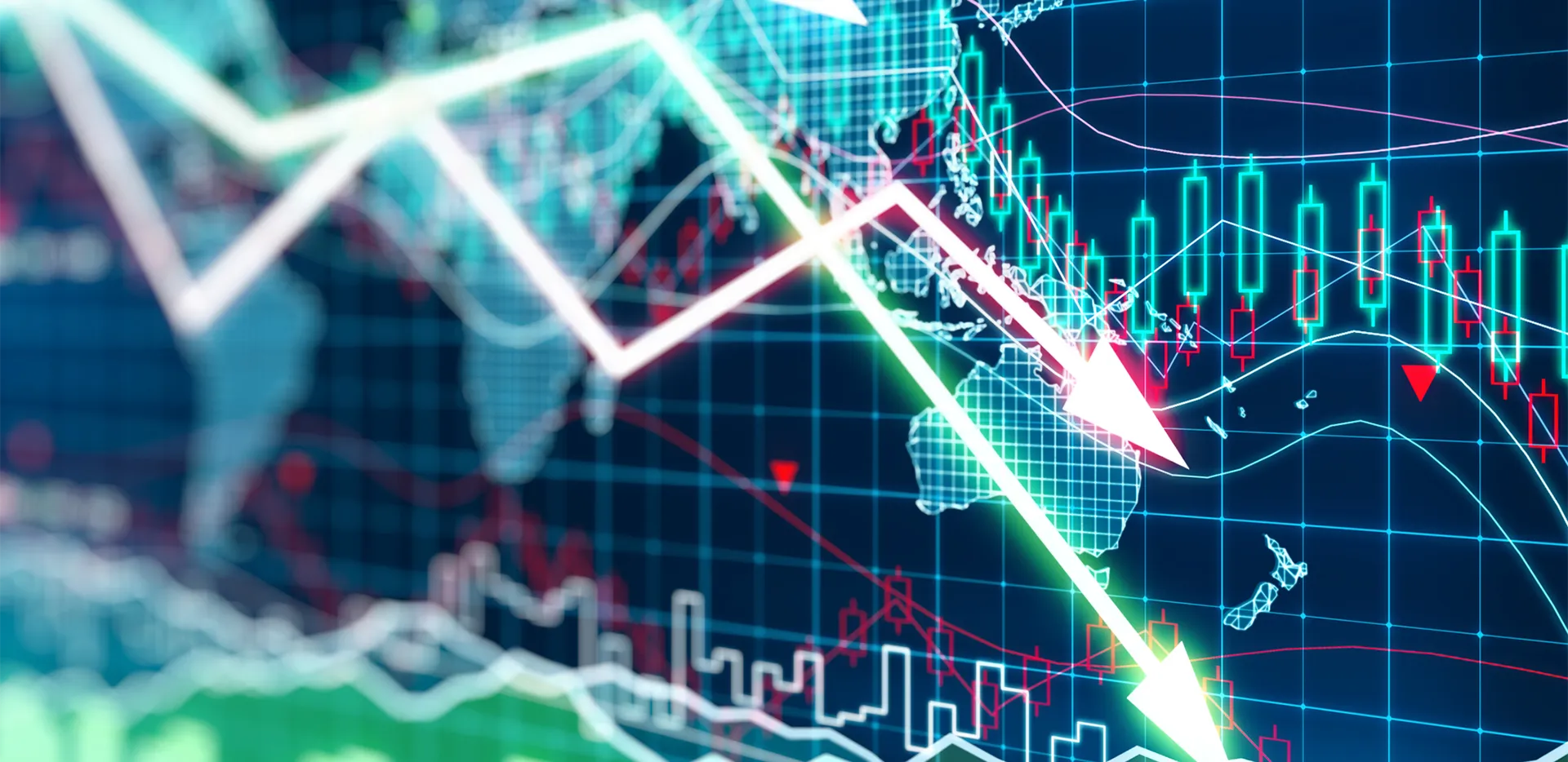 Trend lines pointing down in front of a digital map.