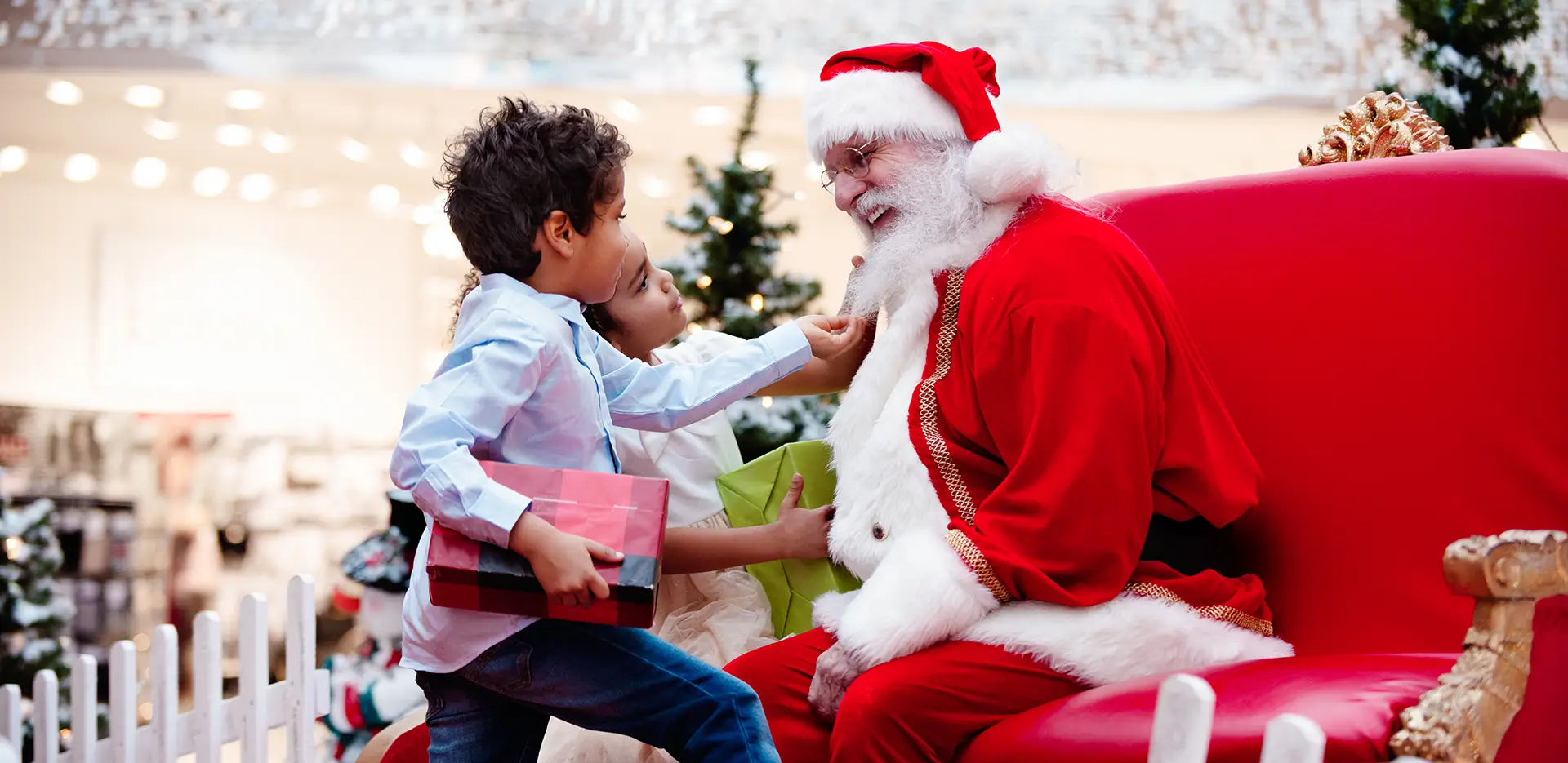 Two children meet Santa Claus.
