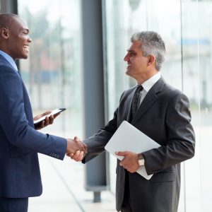 businessmen handshaking hey